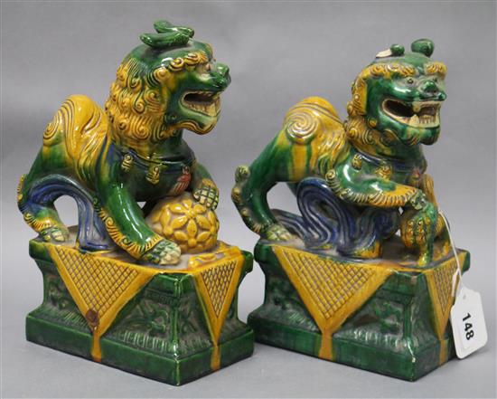 A pair of Chinese sancai Temple dogs, late 19th/early 20th century tallest 27cm